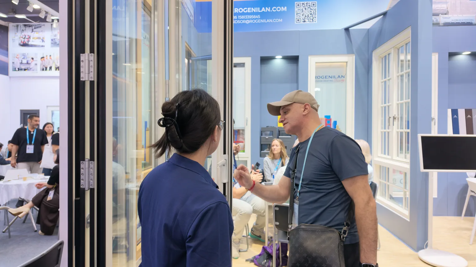 Rogenilan Door Display Conversation in April 2026 Door panels and a product conversation at the Rogenilan booth in April 2026